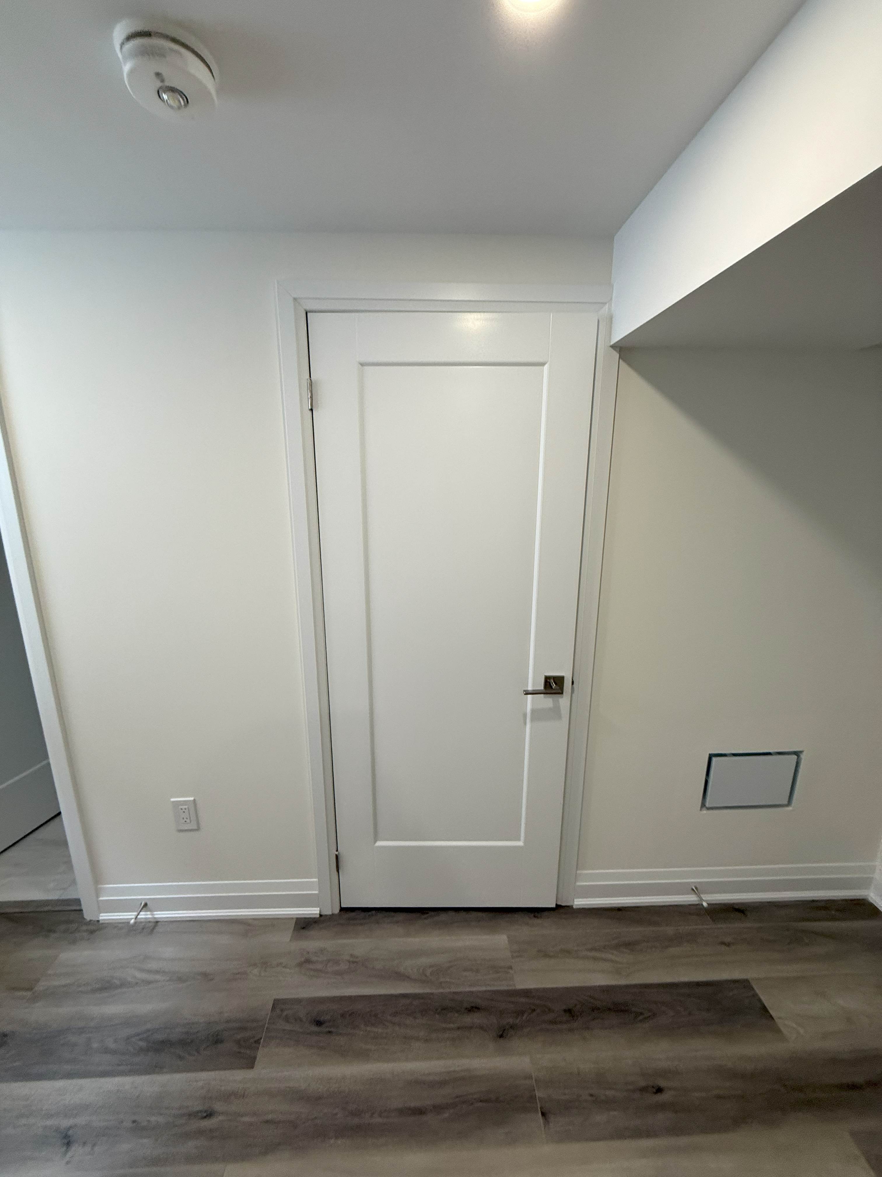 Renovated room entrance and smooth ceiling plaster