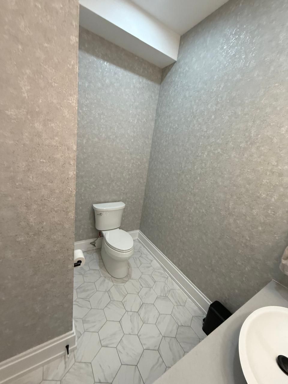 Luxury bathroom renovation with custom hexagonal marble tile